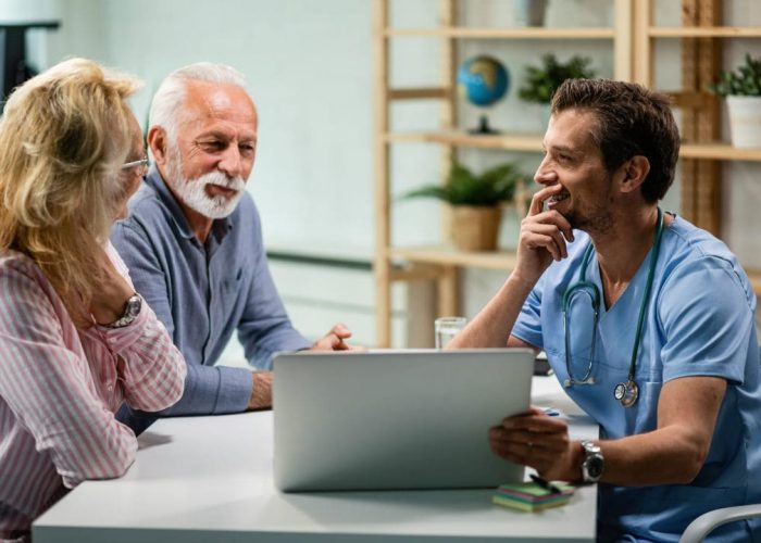 A doctor consulting with a senior couple